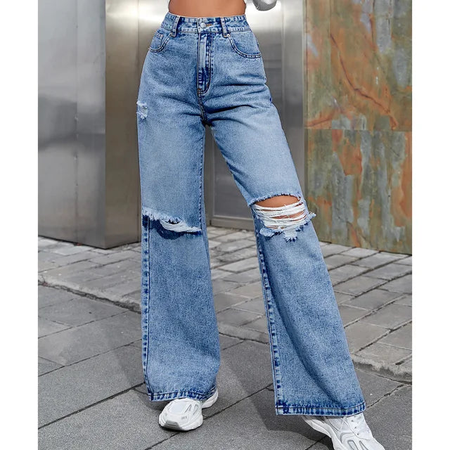 Blauwe losse gescheurde damesjeans hoge taille, rechte wijde pijpen
